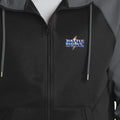 Close-up of the matching Battle Bowl left-chest logo, clear of the zipper.